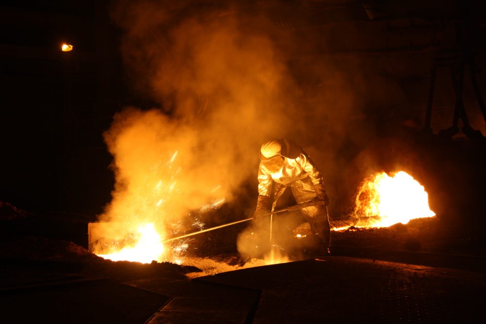 Steel worker wearing Protective clothing in a high temperature environment - yarn wholesale uk - SageZander