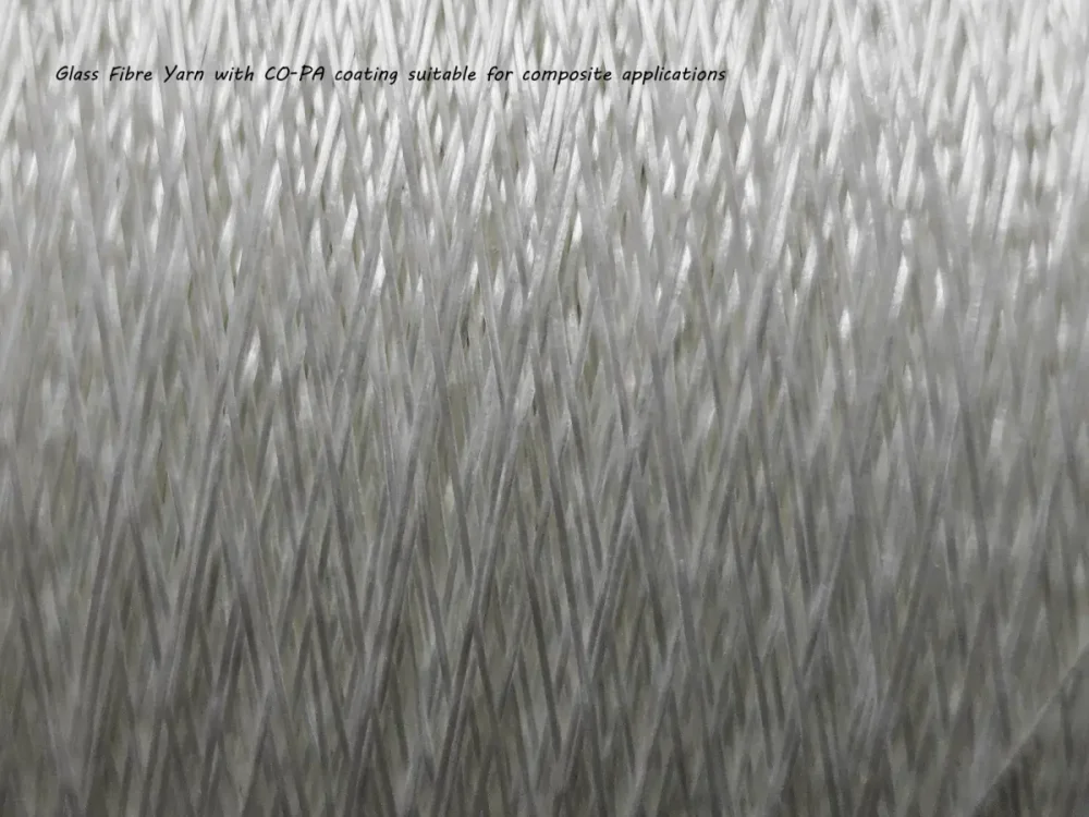 Suitable for composite applications, here a co-polymer polyamide is coated onto a galss fibre yarn.